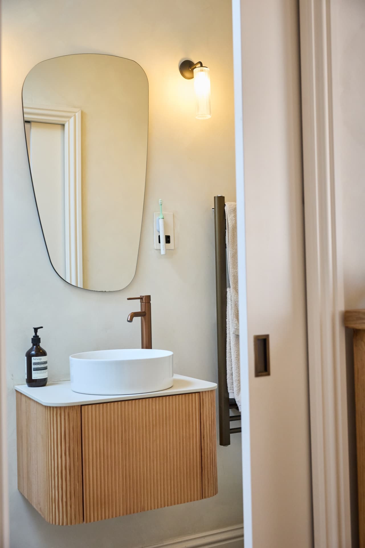 Fluted oak bathroom vanity at Cambridge Terrace