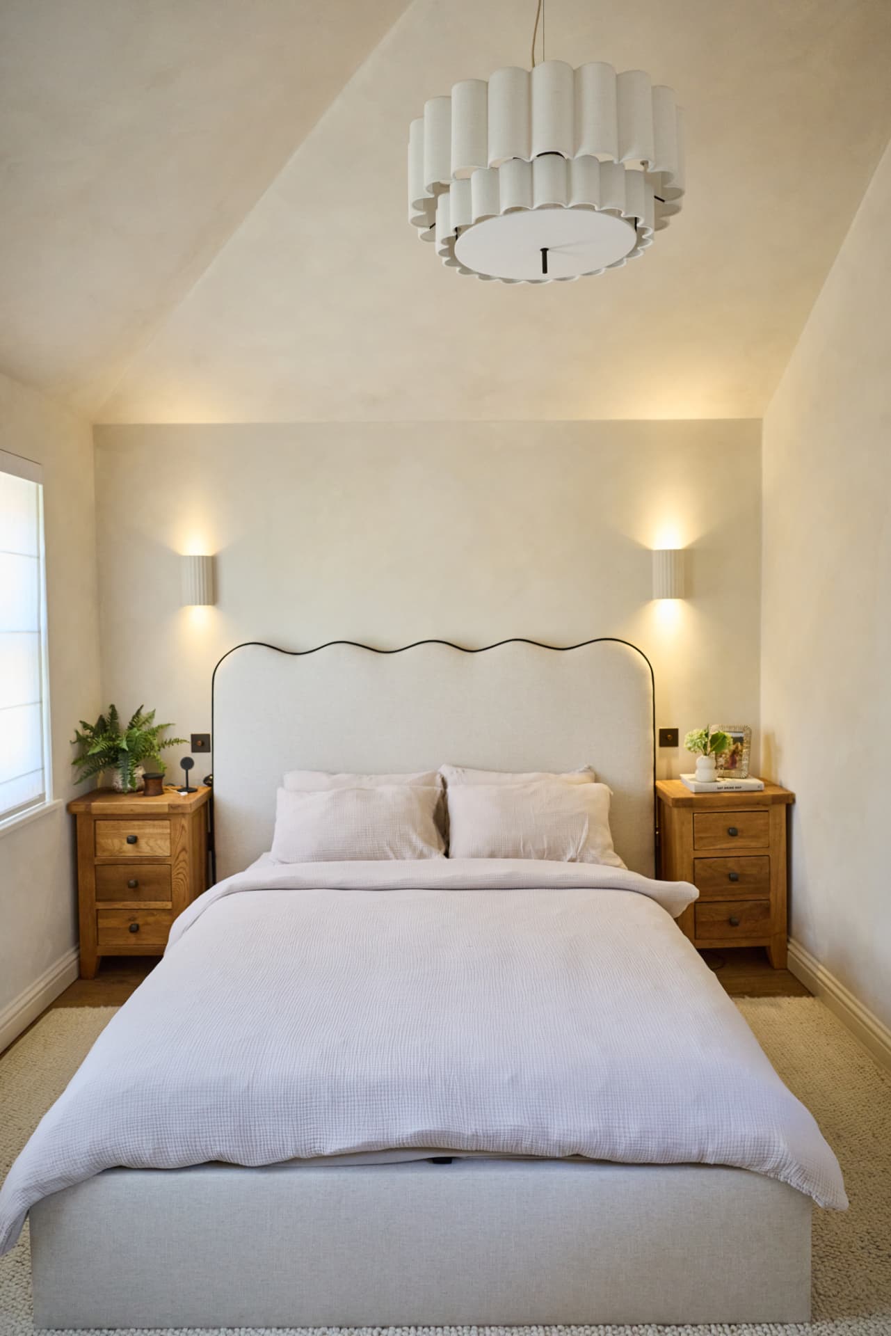 Bedroom with scalloped headboard at Cambridge Terrace